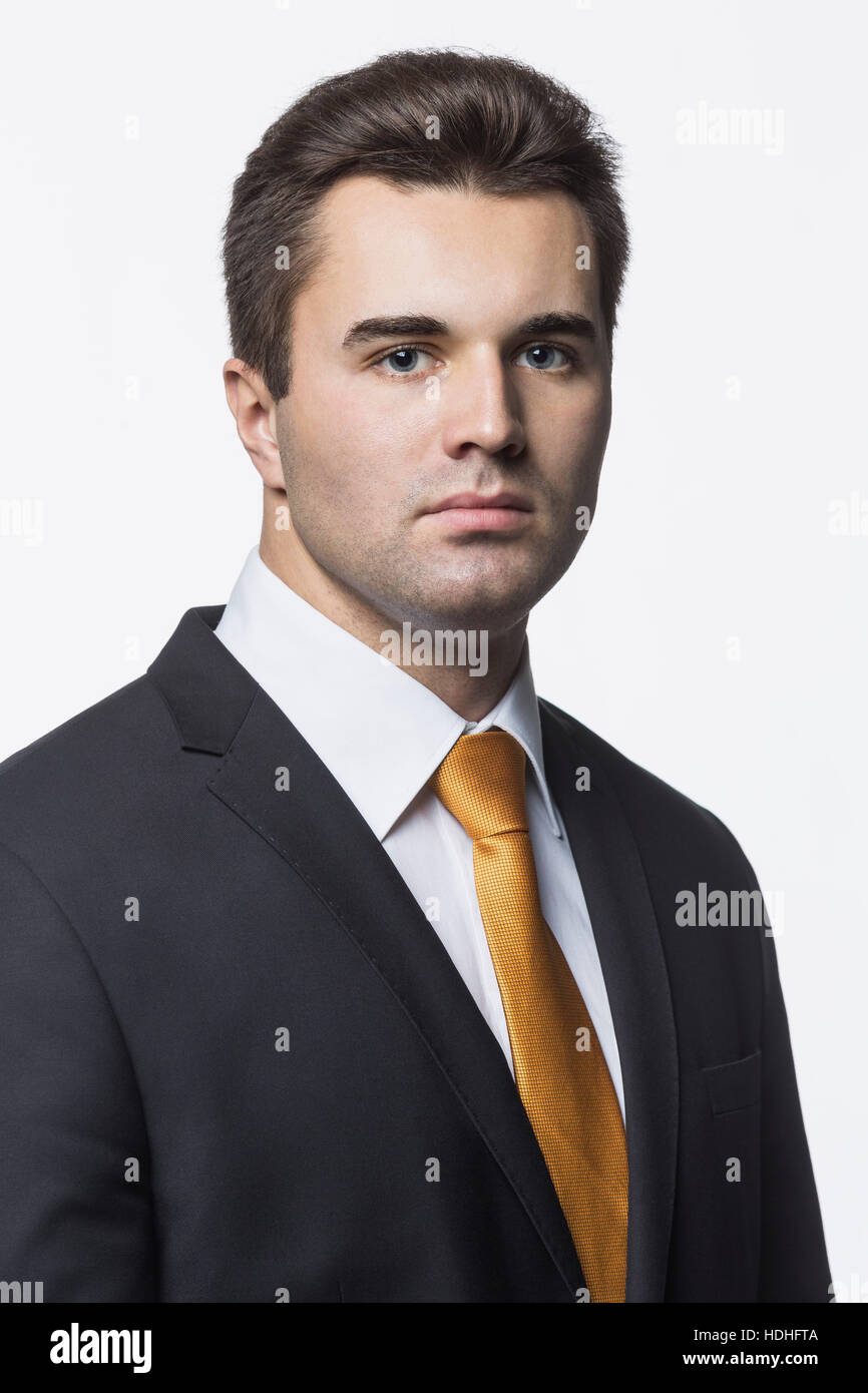 Portrait of confident businessman against white background Stock Photo