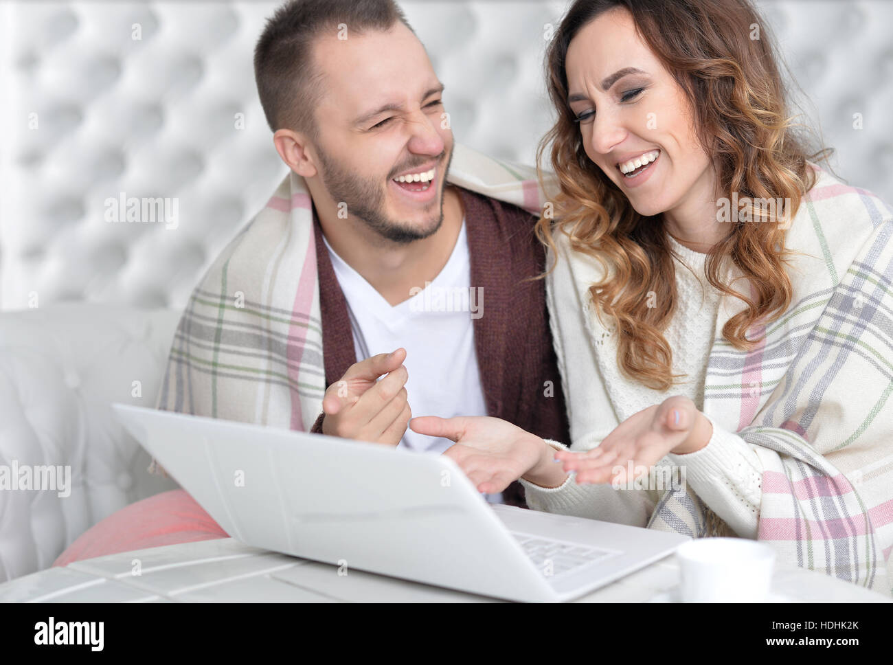 Young couple with laptop Stock Photo - Alamy