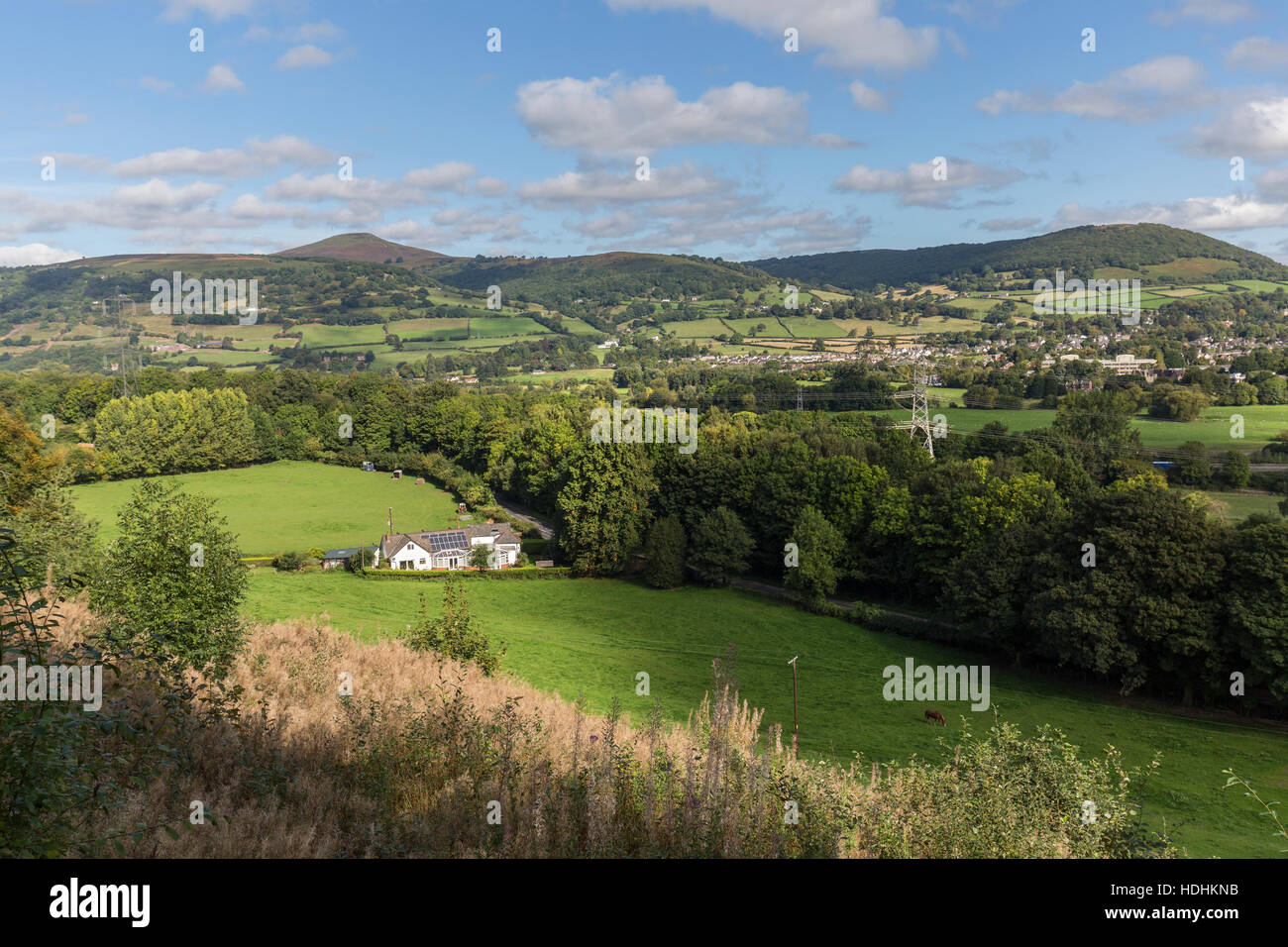 House with solar panels in rural setting with Sugar Loaf mountain in distance near Abergavenny, Wales, UK Stock Photo