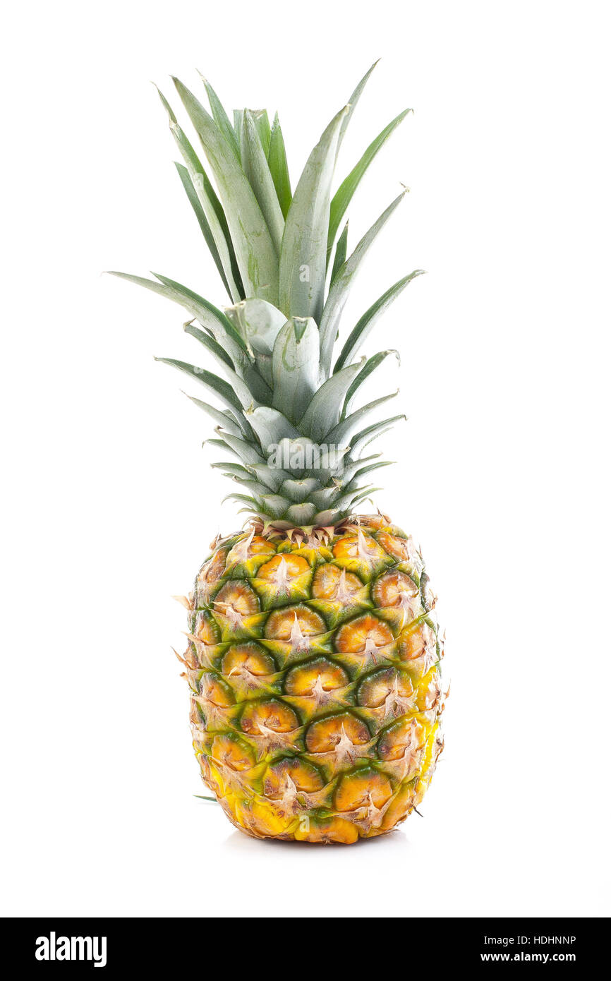 Pineapple in white studio background. Sweet delicious mellow tropical fruit. Full whole yellow pineapple. Stock Photo