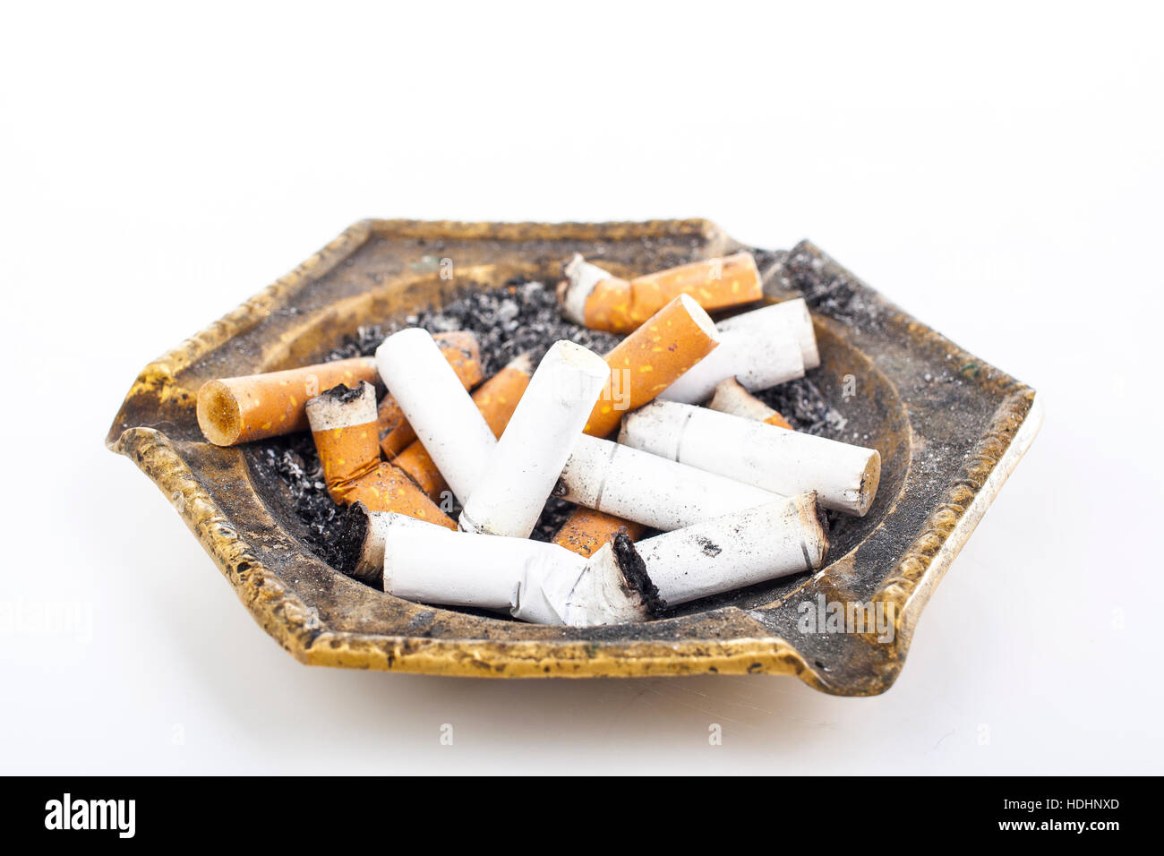 Full ashtray can illustrate your work. Copper cigarette ashtray. Dirty