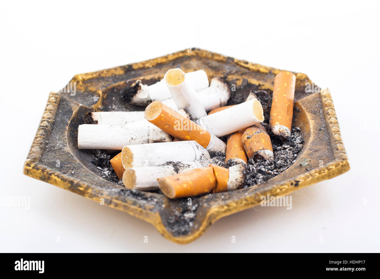 Full ashtray can illustrate your work. Copper cigarette ashtray. Dirty