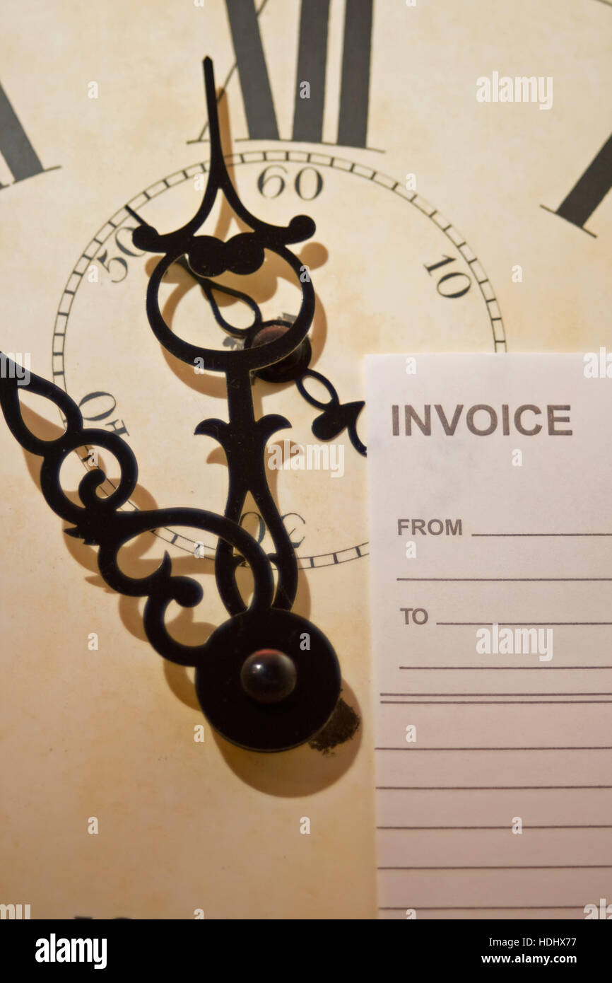 Clock face with invoice. The concept of 'time is money'. Stock Photo