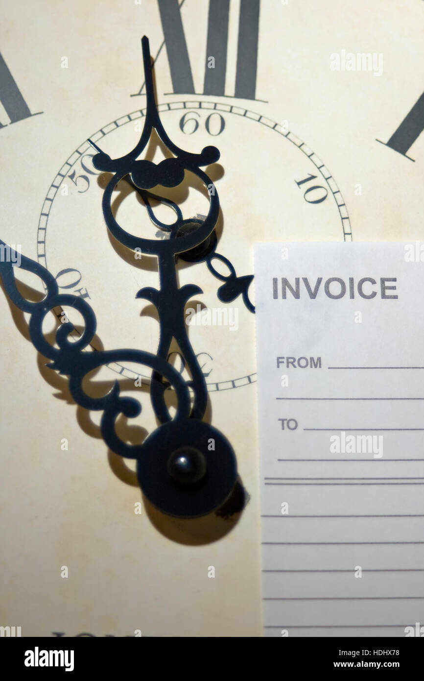 clock face and blank invoice. Concept of 'time is money'. Stock Photo