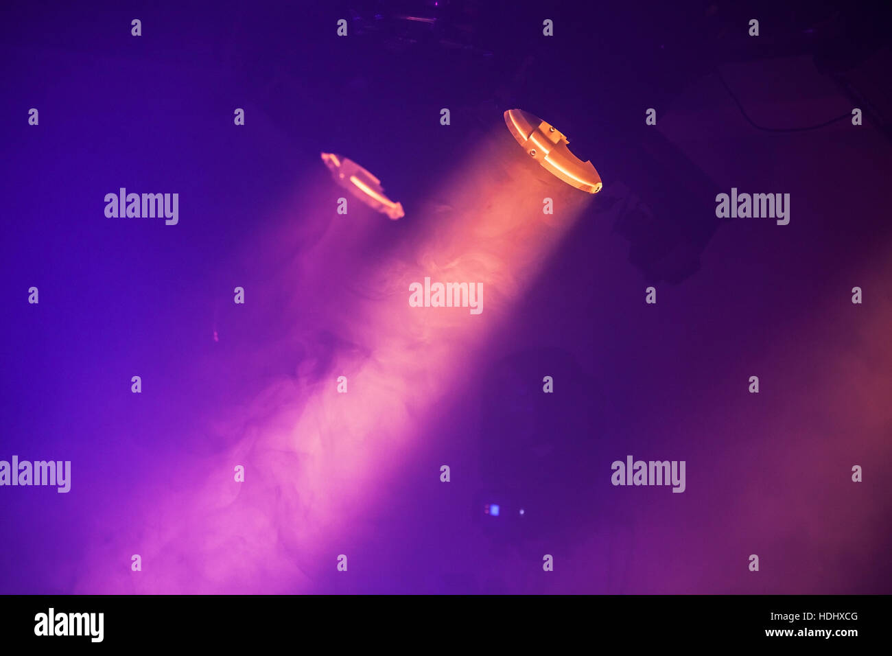 Spot lights with purple rays in the dark, stage illumination equipment Stock Photo