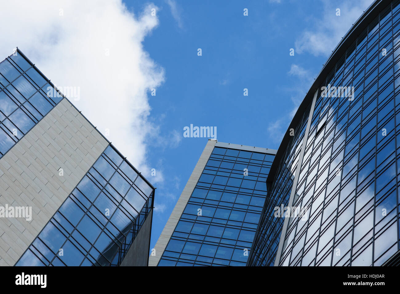 multistory glass office building on a background of the sky Stock Photo ...