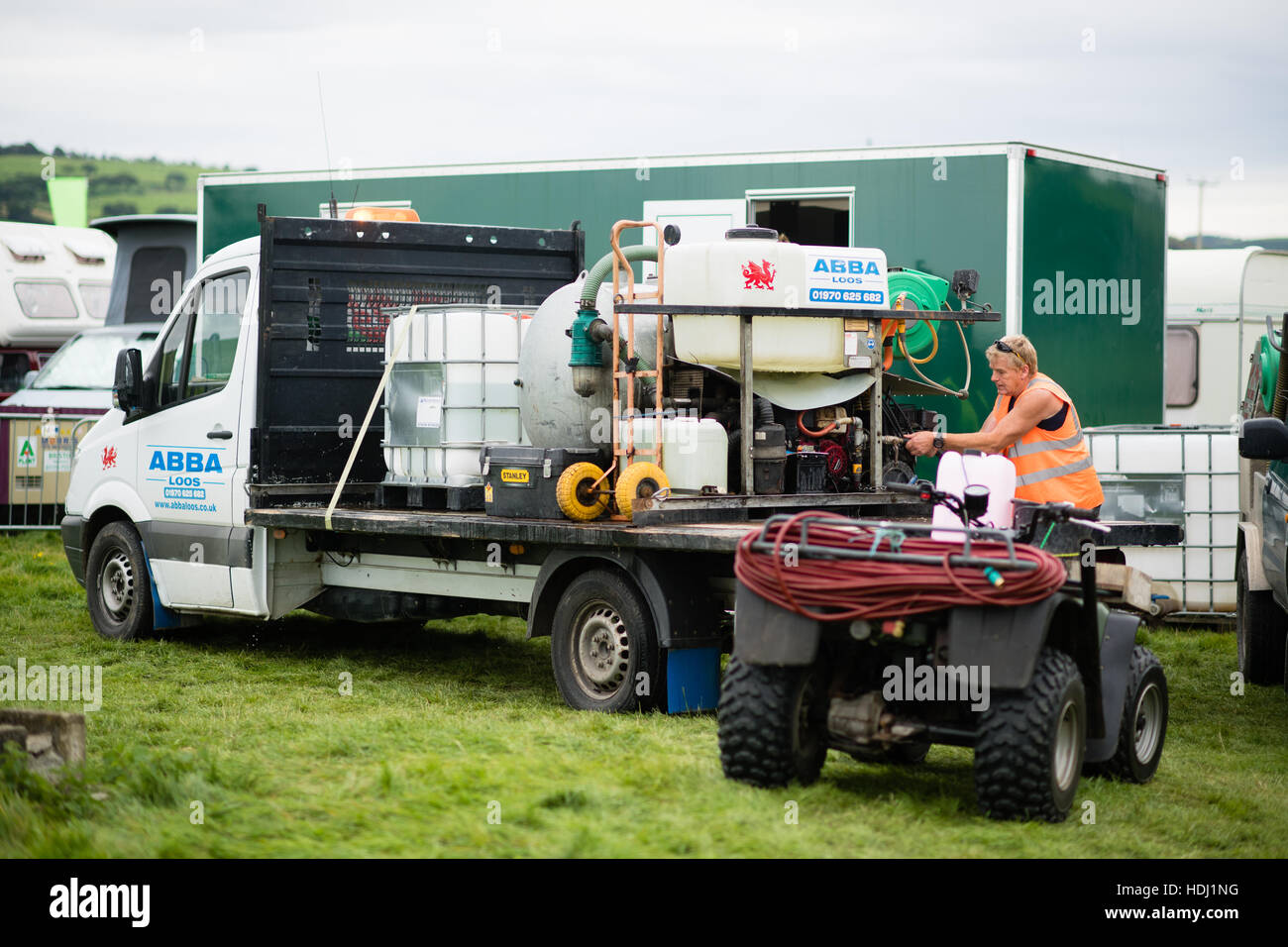 Behind the scenes: A contractor servicing themobile toilets  at The 2016 Big Tribute music festival, on the outskirts of Aberystwyth Wales UK,  held every year on the August Bank Holiday weekend,. Stock Photo