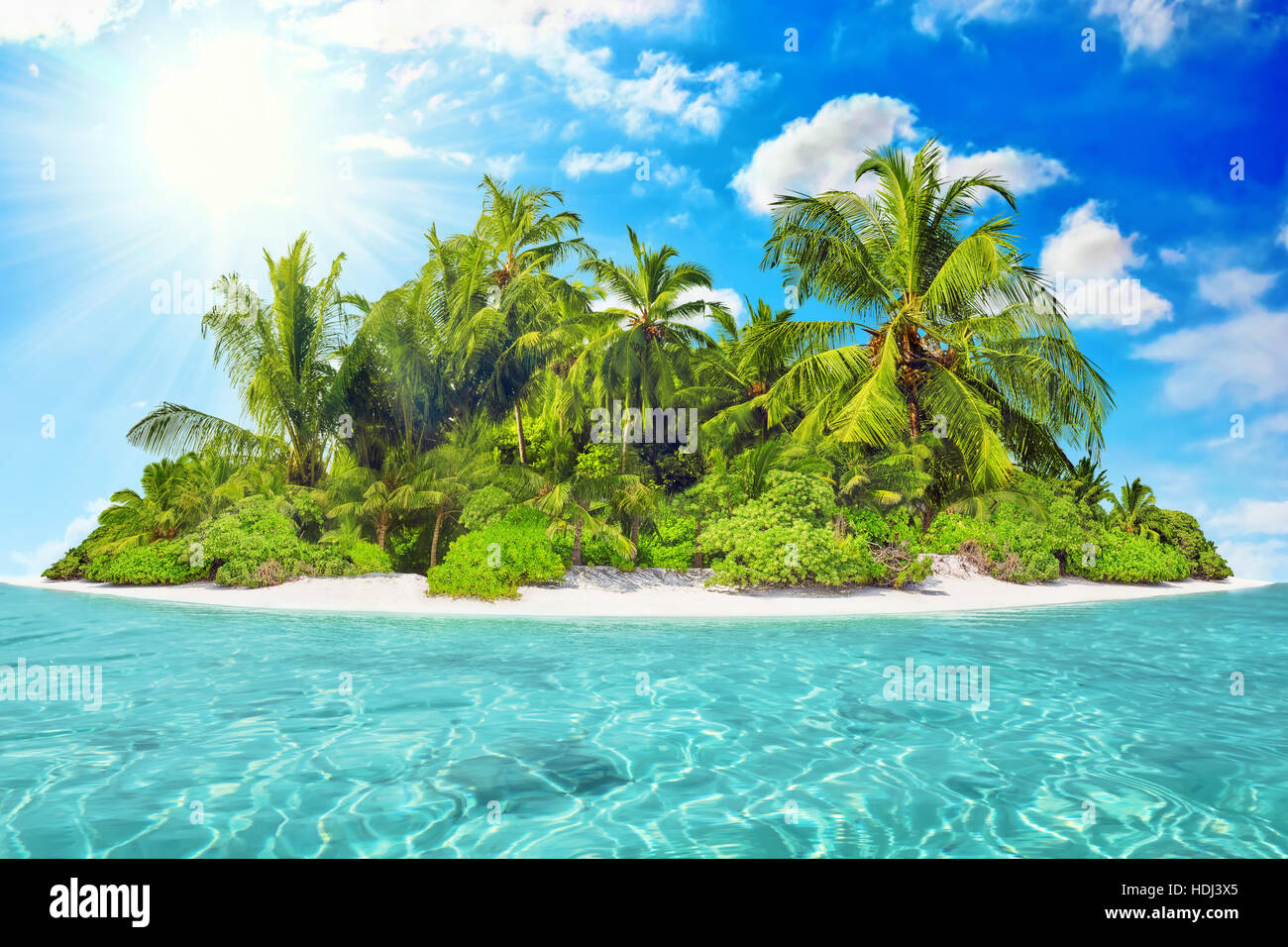 Whole tropical island within atoll in tropical Ocean on a summer day