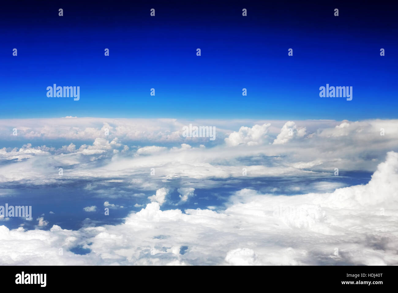 Beautiful view above the earth at the clouds below Stock Photo Alamy