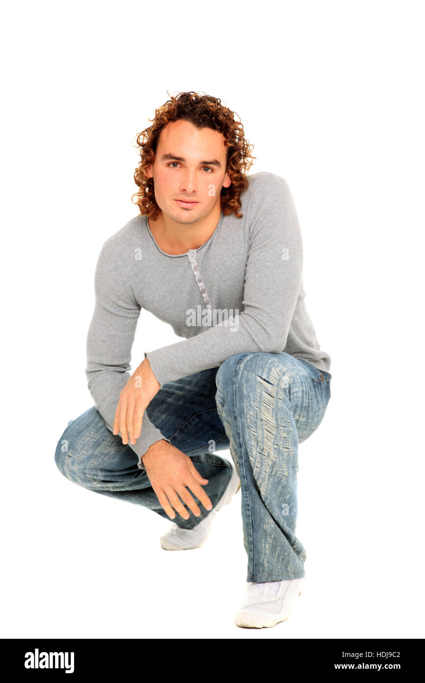 young man posing on a studio isolated on a white background Stock Photo ...