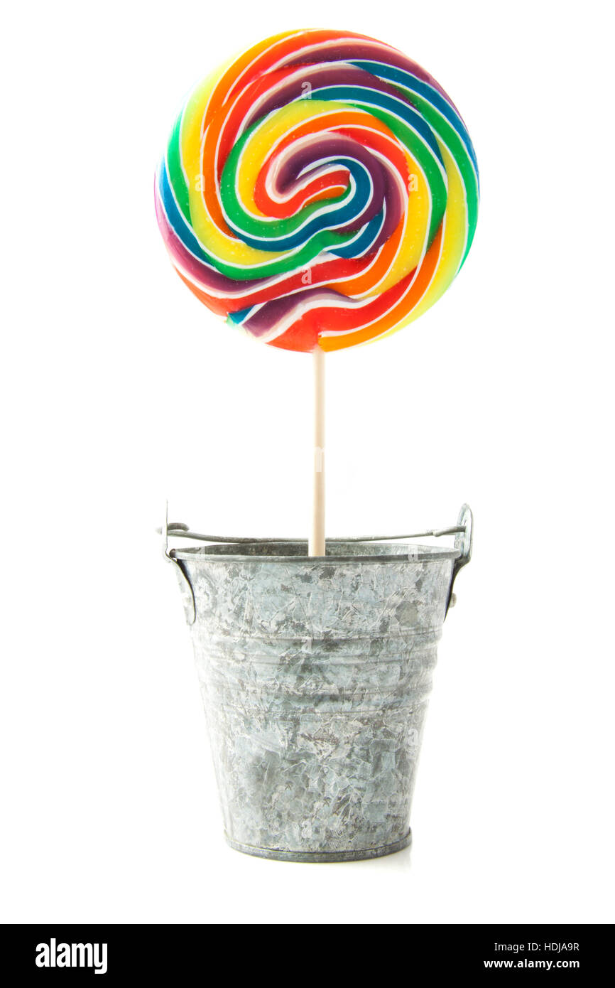 Colorful rainbow lollipop in zinc bucket isolated over white Stock