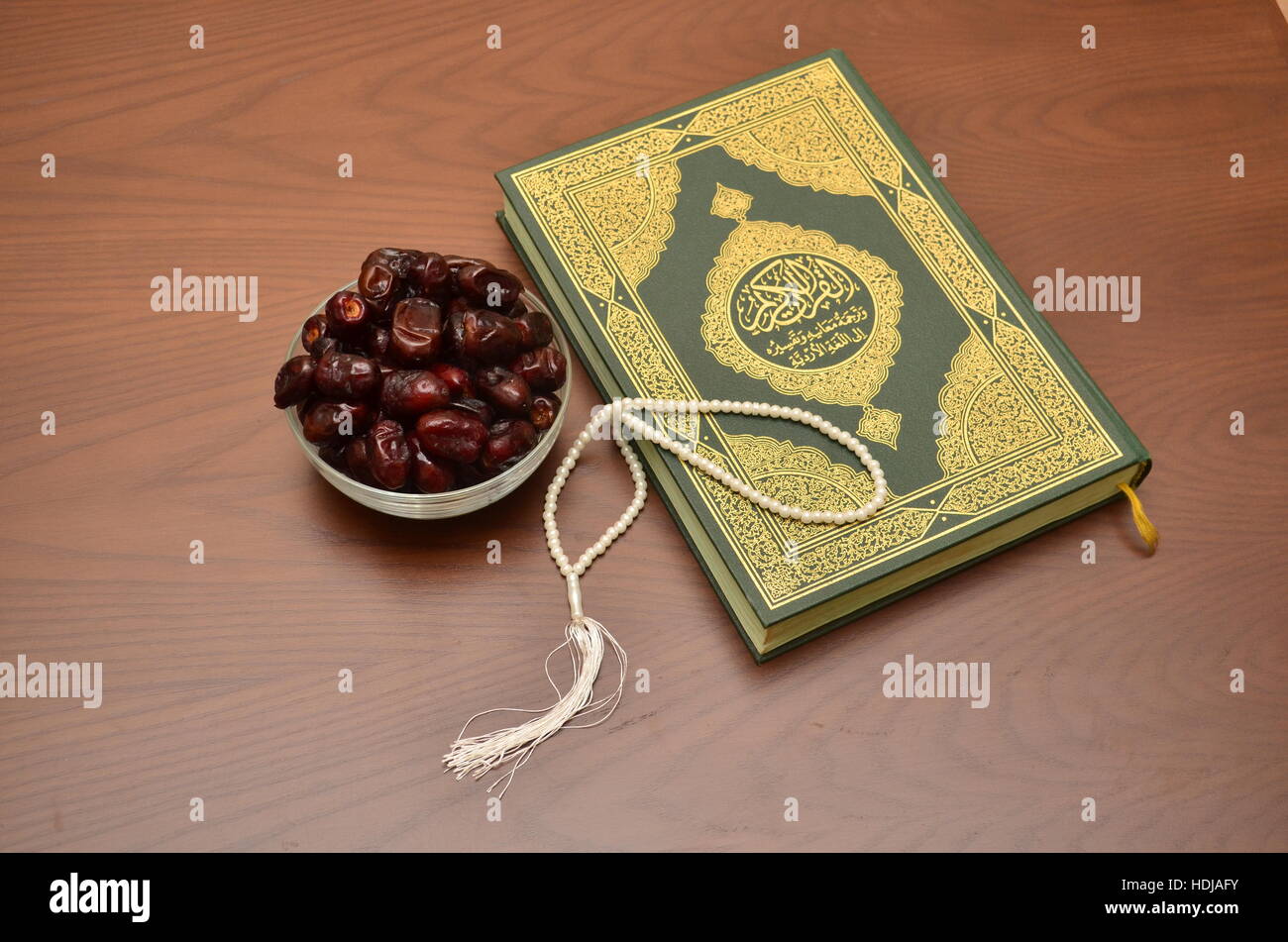 A Holy Quran with Tasbeeh and Dates used in Ramadan during Iftar Stock