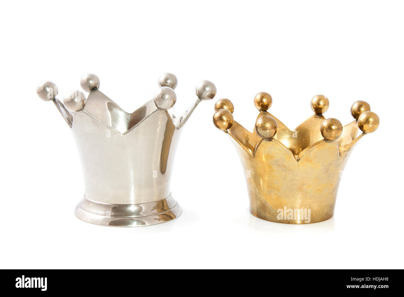Silver crown and golden crown isolated over white Stock Photo