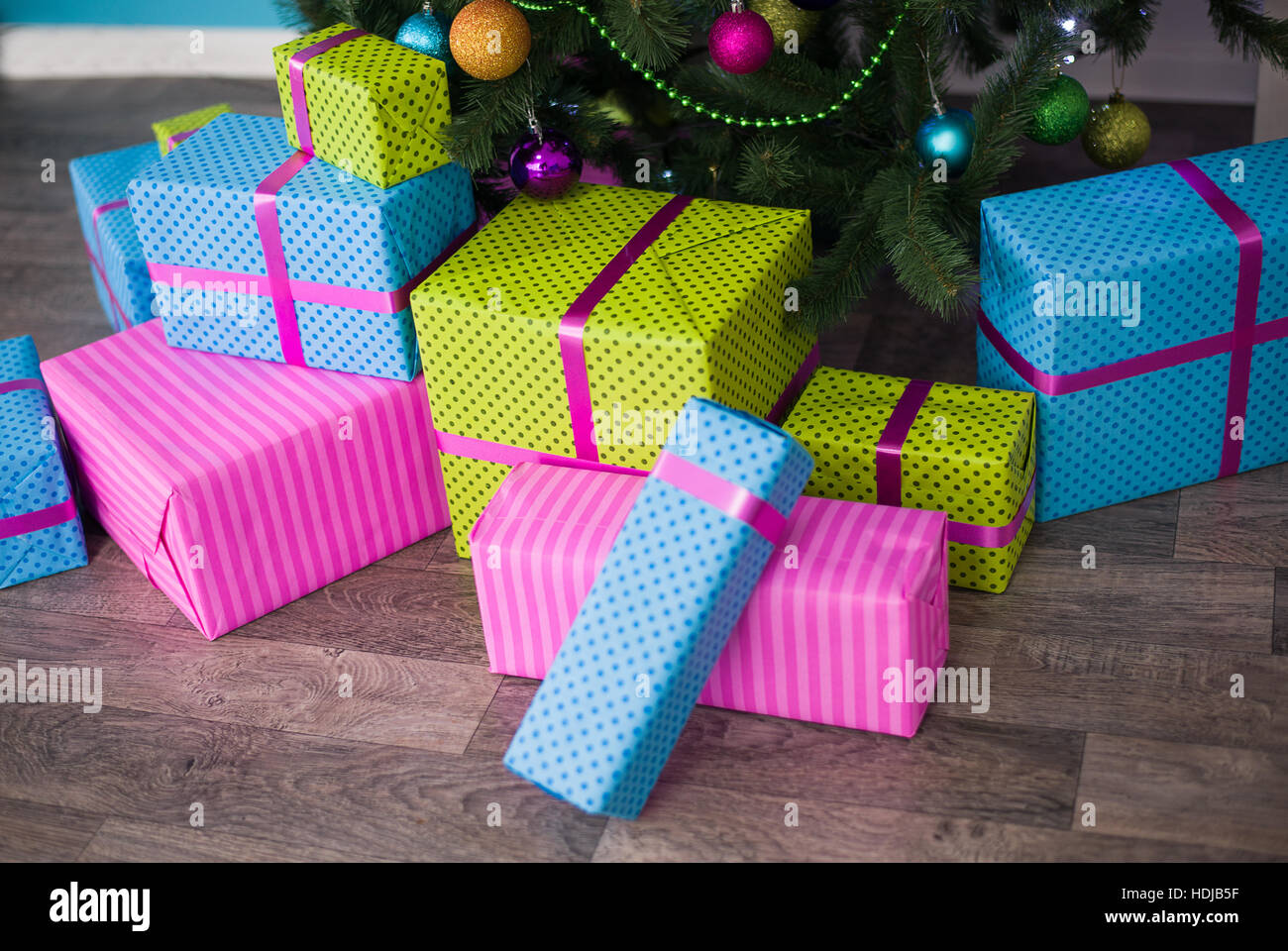 Boxes with Christmas gifts under the tree Stock Photo