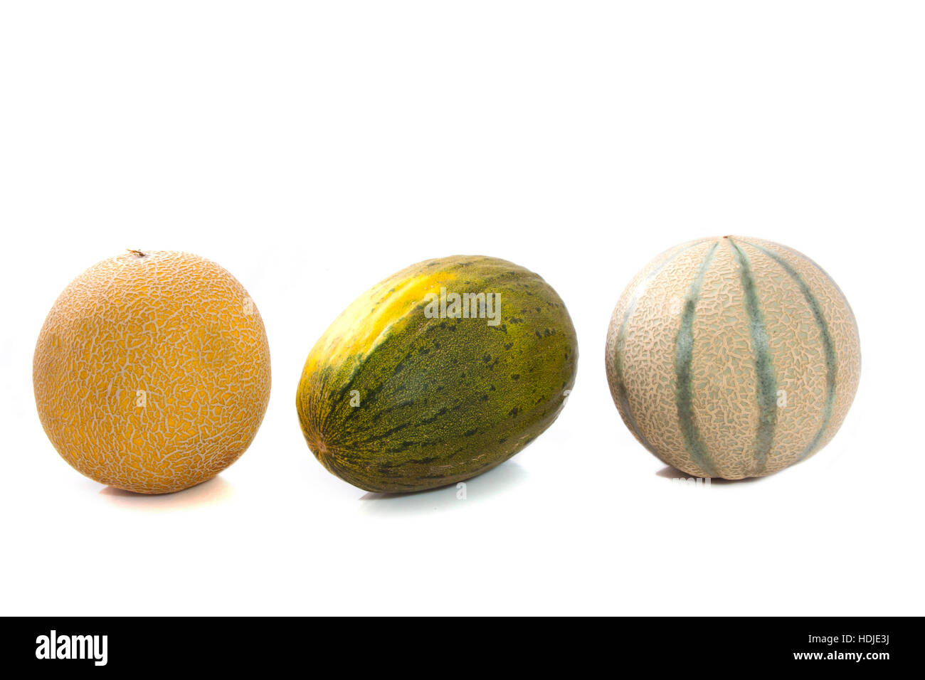 Three fresh melons in a row isolated over white Stock Photo Alamy