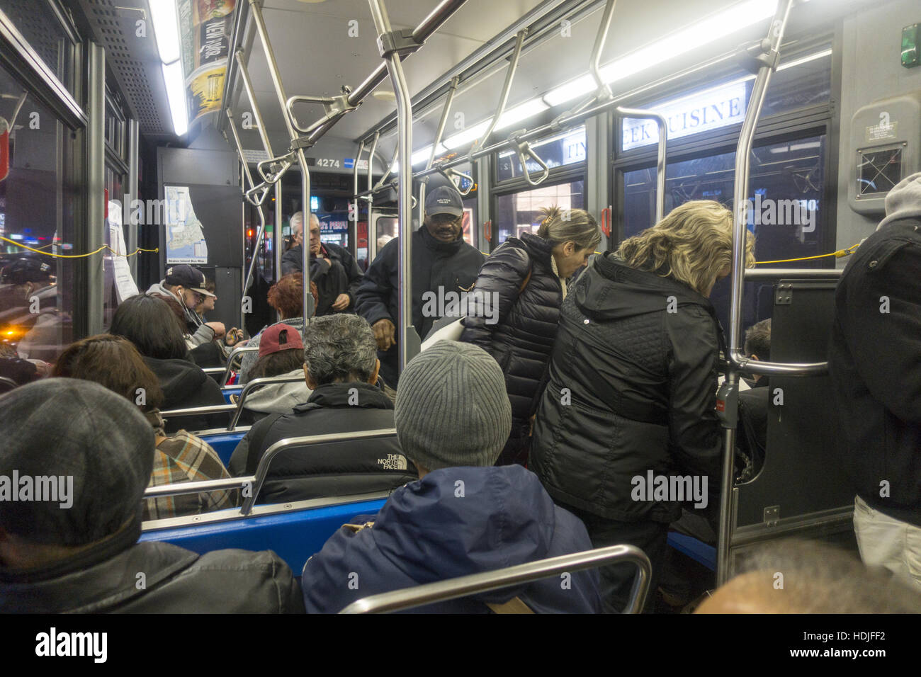 Commuters during the evening rush hour on a bus going from Brooklyn to ...