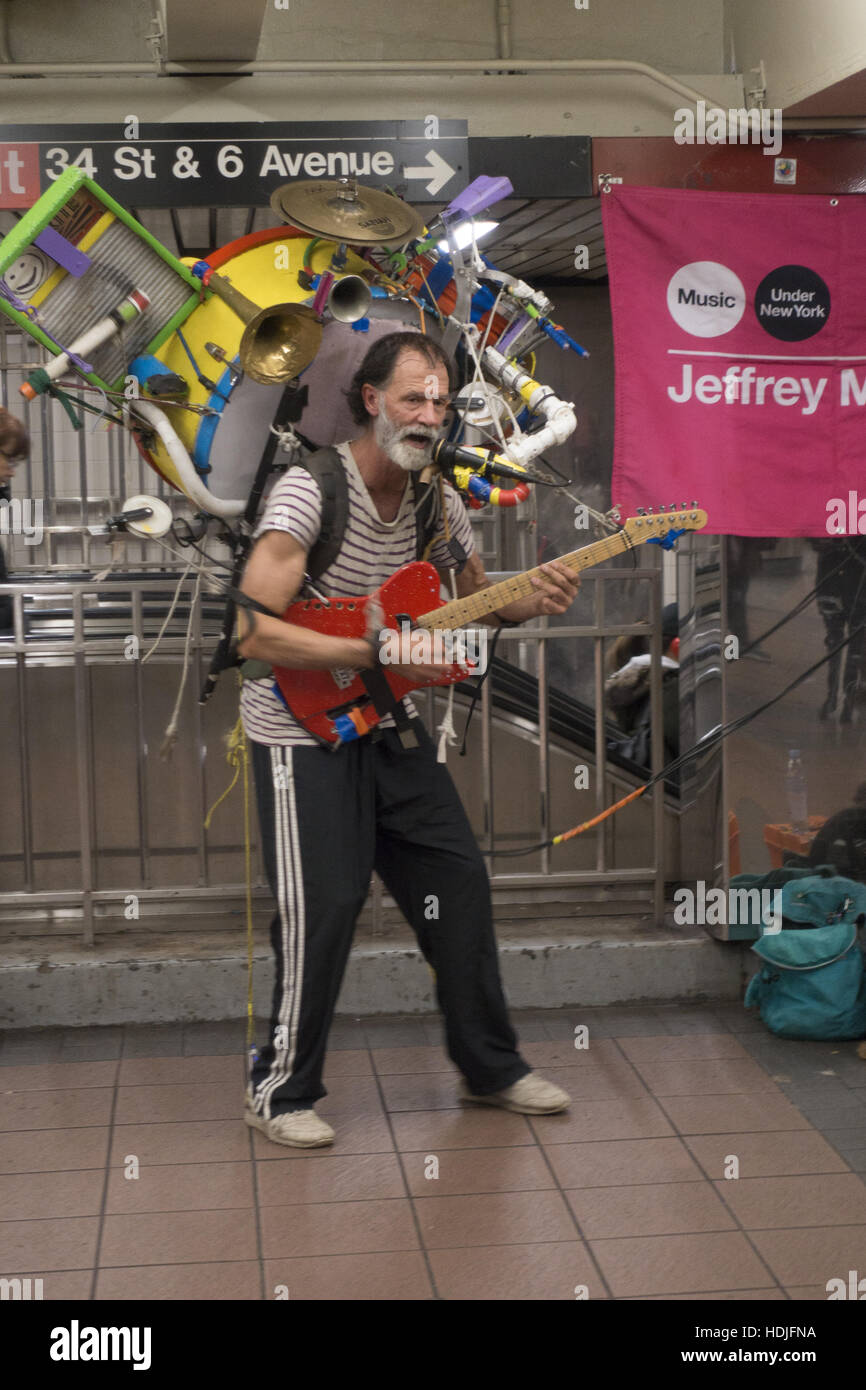 One man band performs at the 34th Street subway station as part of the