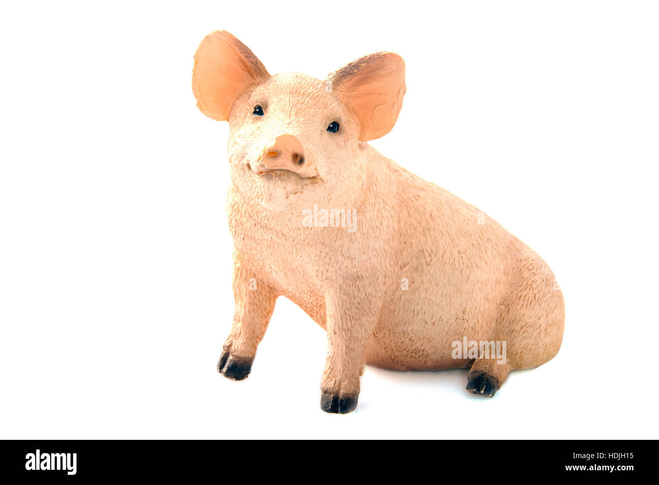 Cute sitting pig figurine isolated over white Stock Photo Alamy