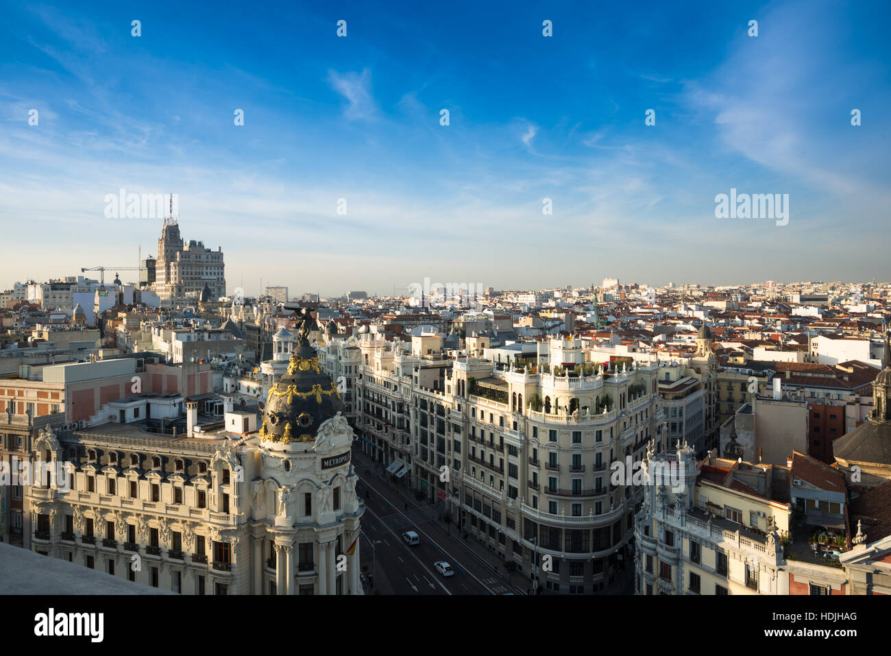 Madrid skyline with Metropolis at the front and Gran via leading to Telefonica tower to the rear. Stock Photo
