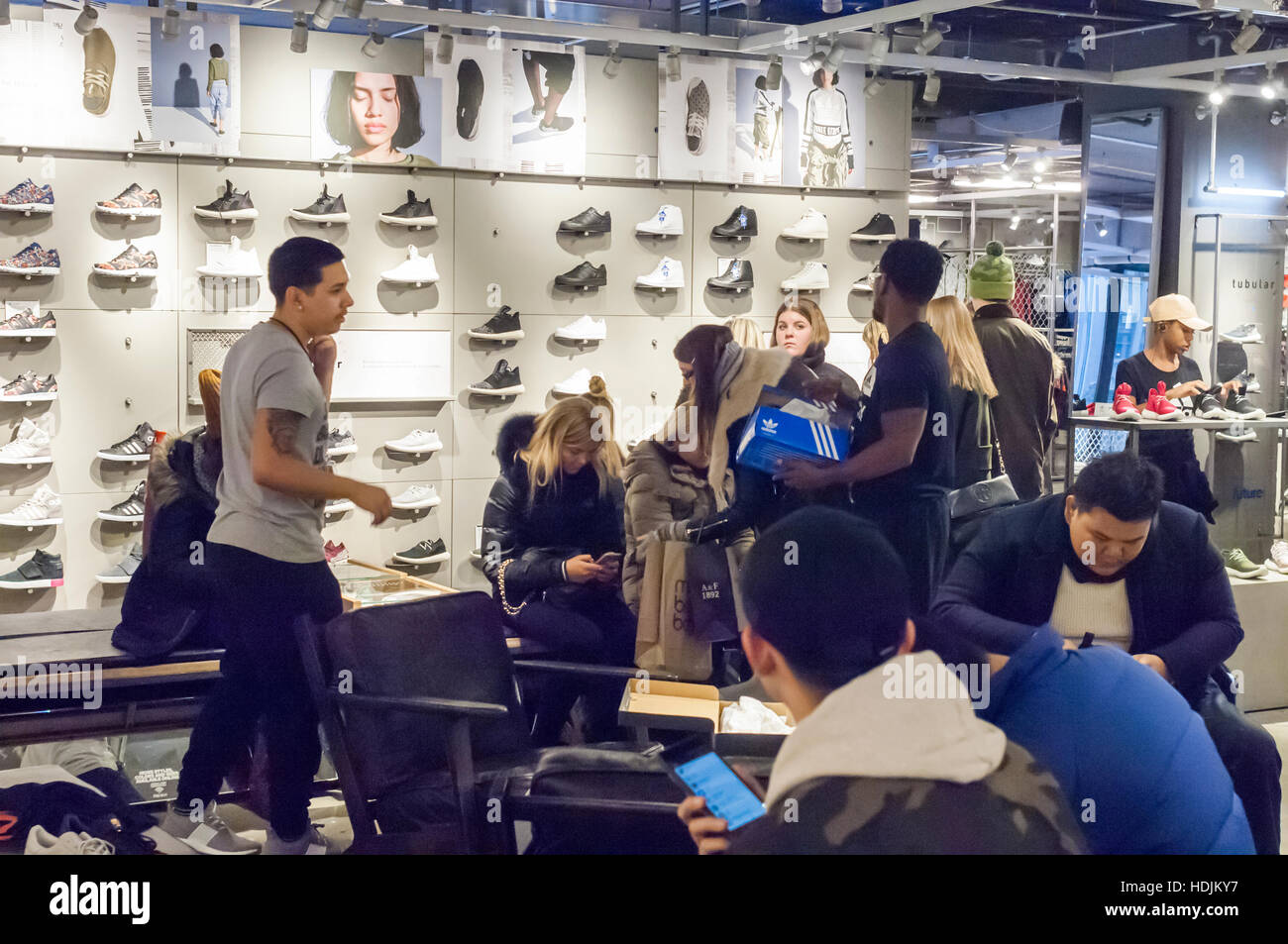 Customers crowd the new Adidas flagship store on Fifth Avenue in New York  on Sunday, December 11, 2016. At 45,000 square feet the store is Adidas'  largest. Nike, the world's largest manufacturer