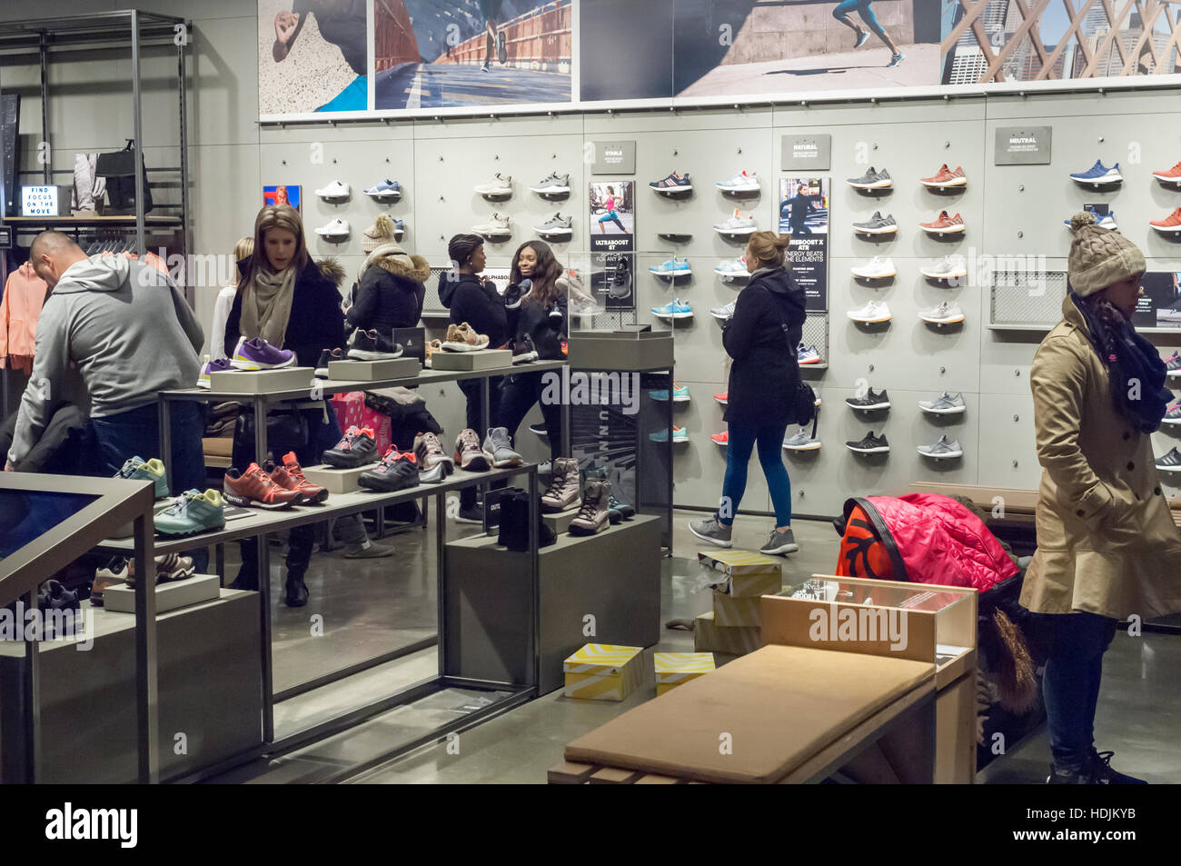 Customers crowd the new Adidas flagship store on Fifth Avenue in New York  on Sunday, December 11, 2016. At 45,000 square feet the store is Adidas'  largest. Nike, the world's largest manufacturer