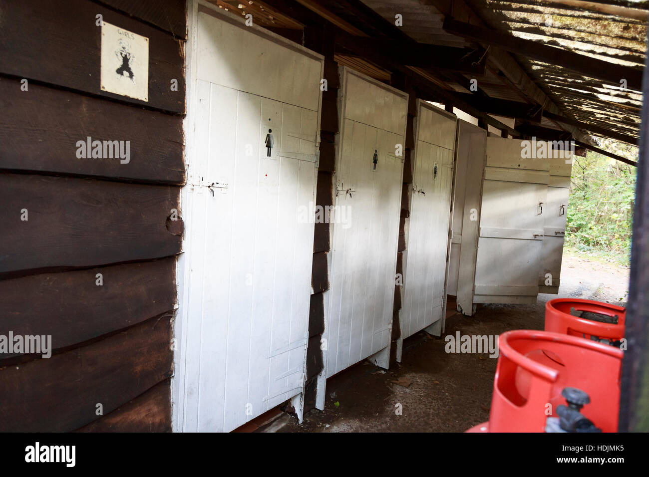 rustic wooden campsite toilet block Stock Photo