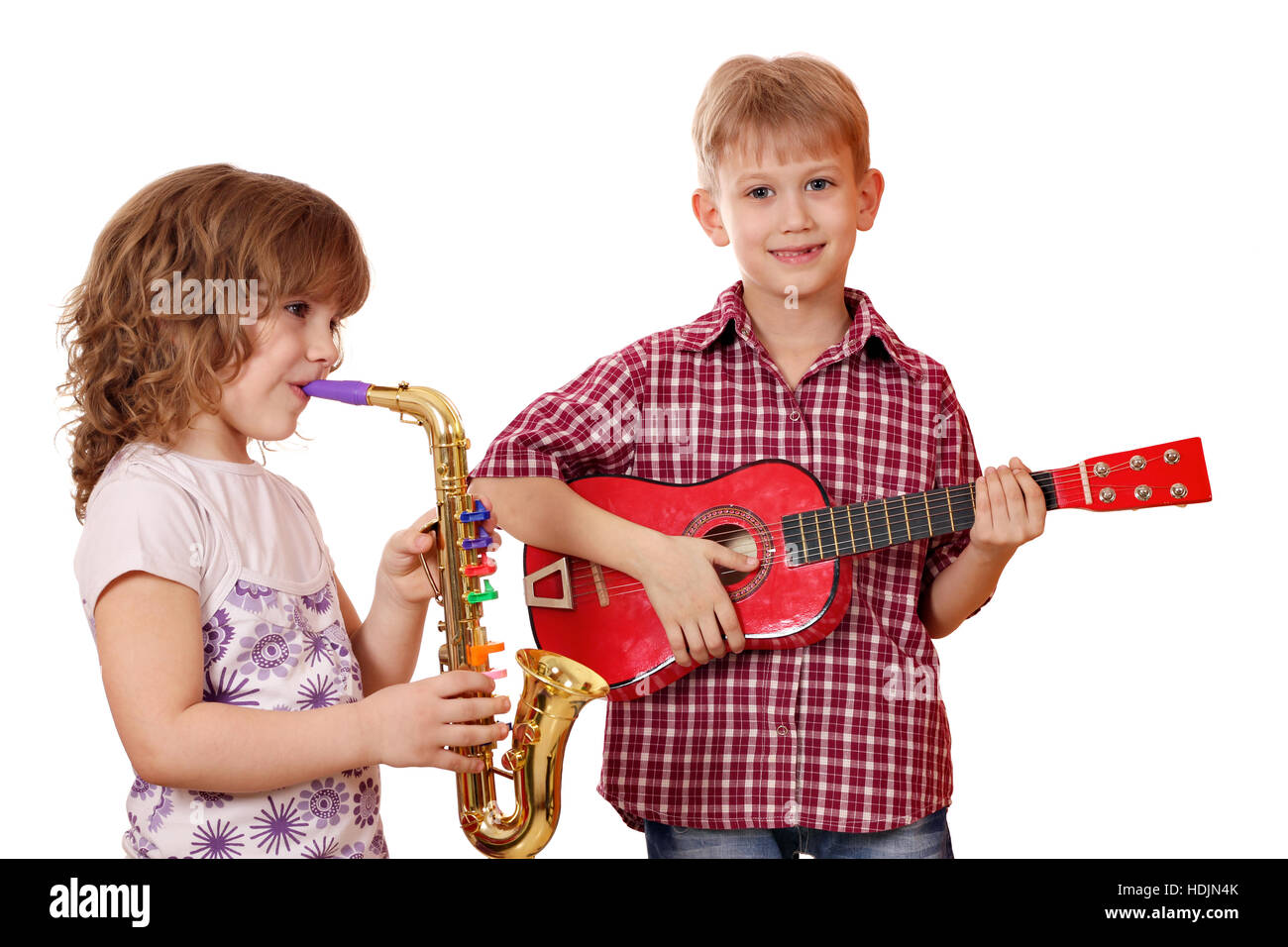 little girl and boy play music Stock Photo