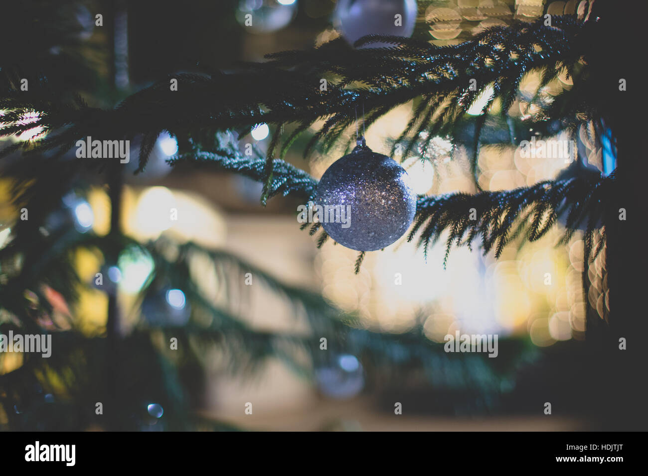 Background of Christmas tree with vintage film look. Stock Photo