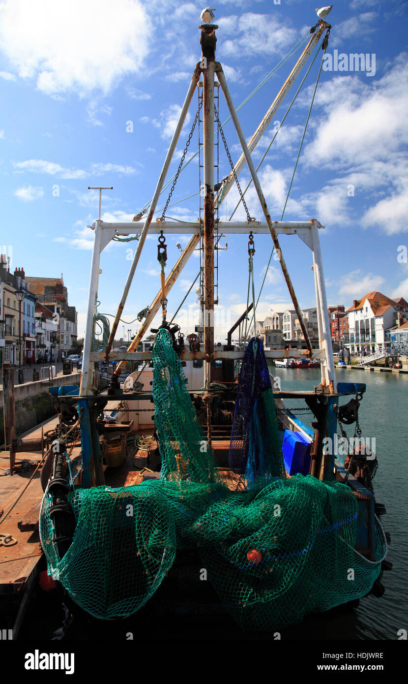 A fishing vessel docked in Weymouth Harbour, Weymouth, Dorset, England