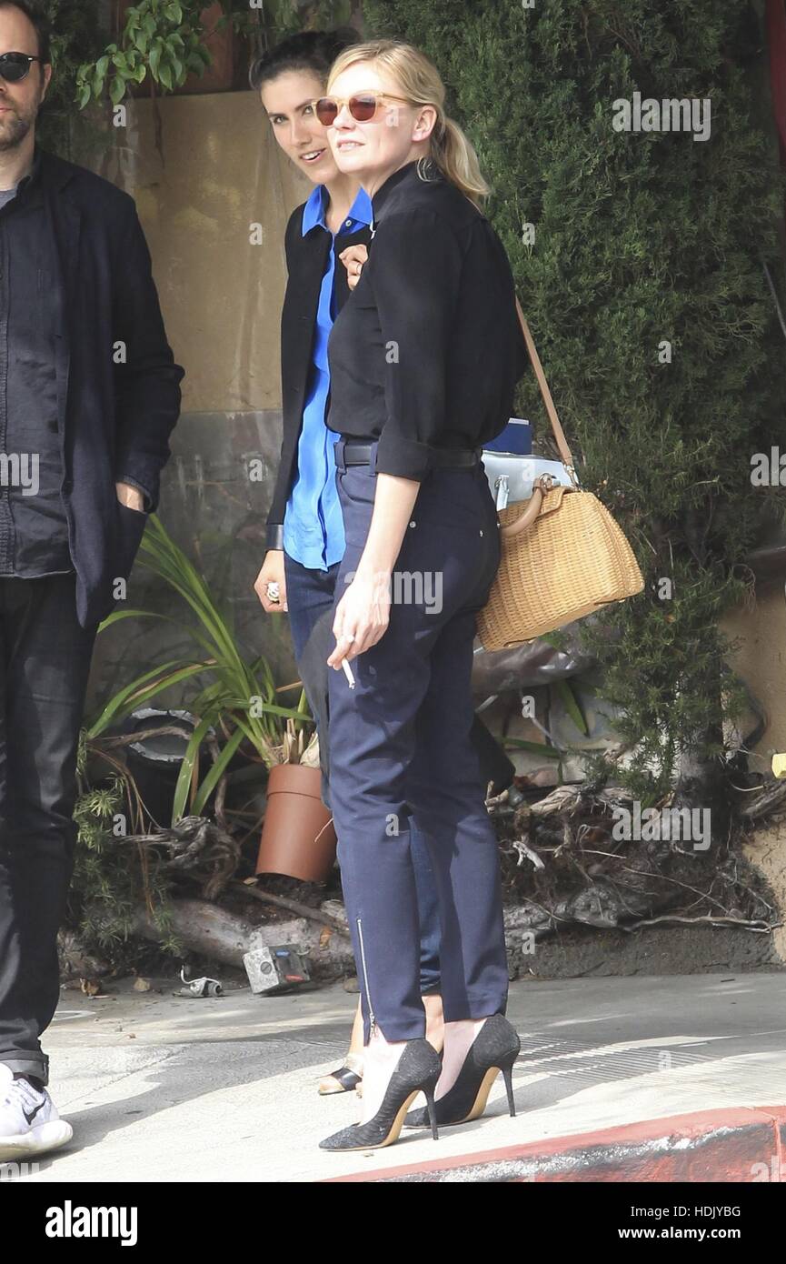 Kirsten Dunst smoking a cigarette after leaving Picolino Restaurant in