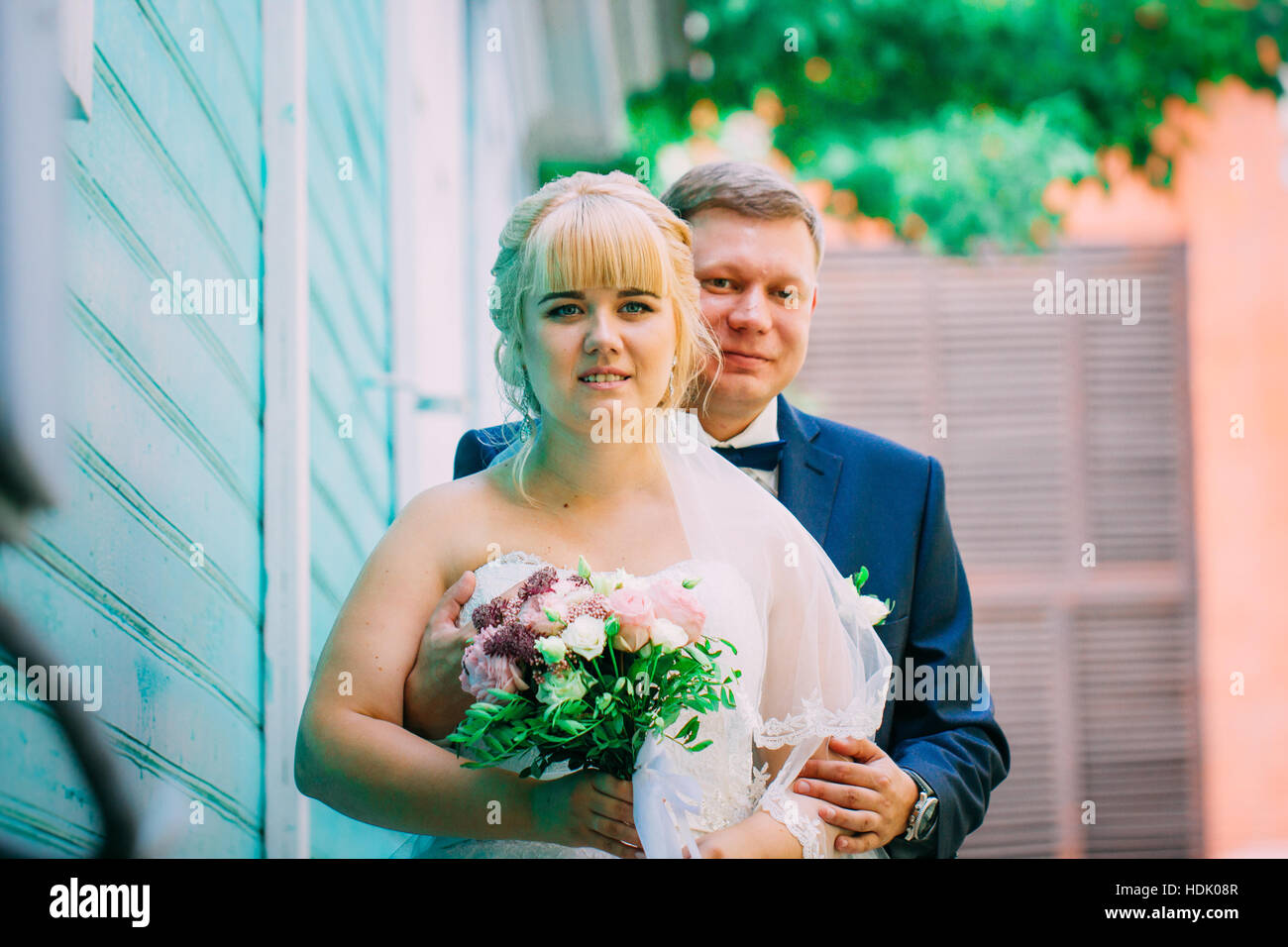 bride and groom on the background of the city Stock Photo - Alamy