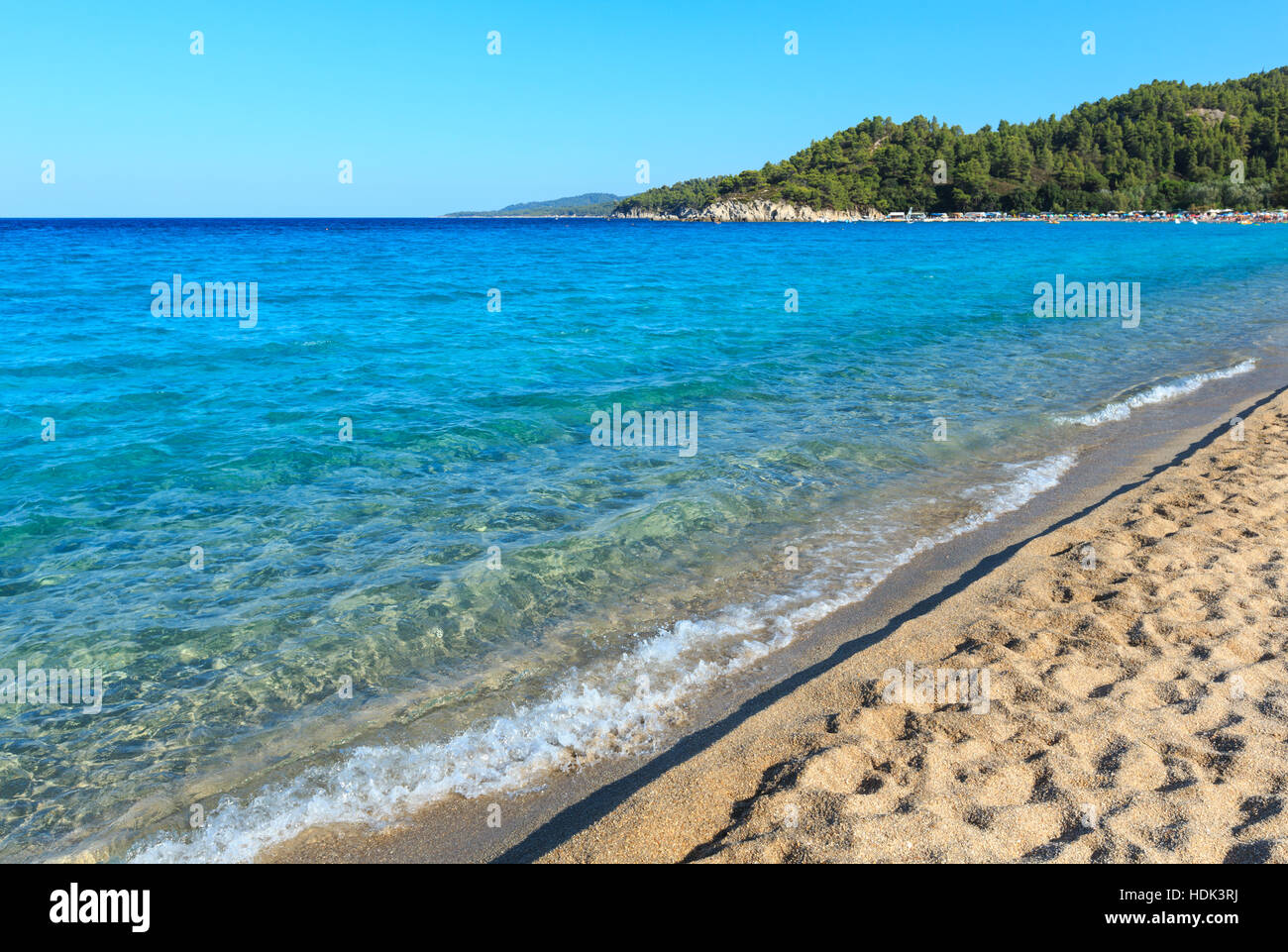 Aegean sea coast landscape with aquamarine water, view from Armenistis beach (Chalkidiki, Greece). Stock Photo