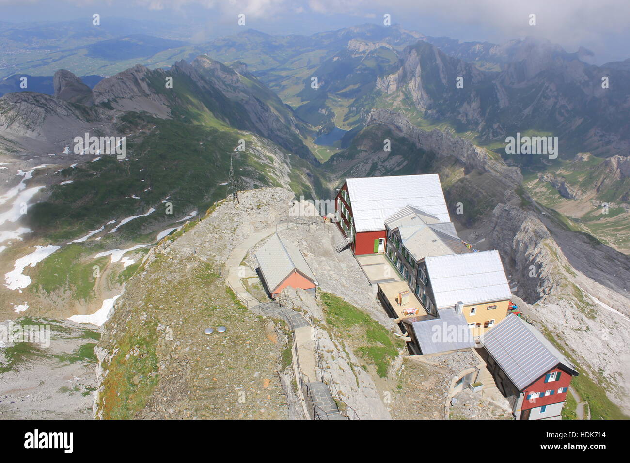 Looking down on a homestead as seen from the peak of Switzerland's Säntis Mountain in the Swiss Alps. Stock Photo