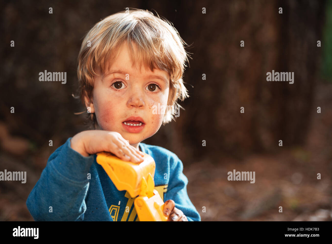 Surprised boy looking at camera. blur background Stock Photo