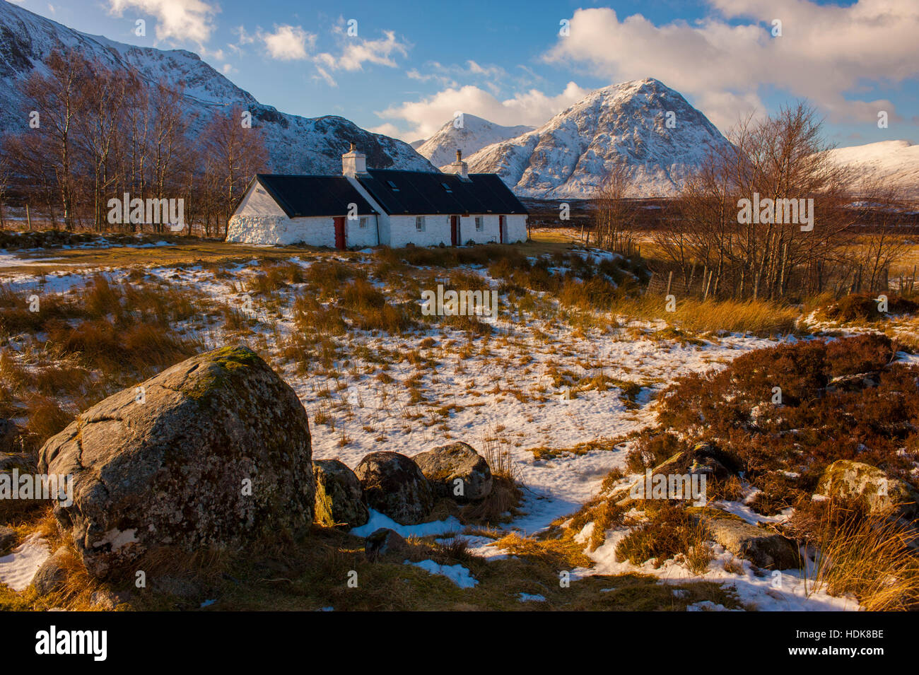 Black Rock Cottage near the entrance to Glen Coe in winter with Stob Dearg behind Stock Photo