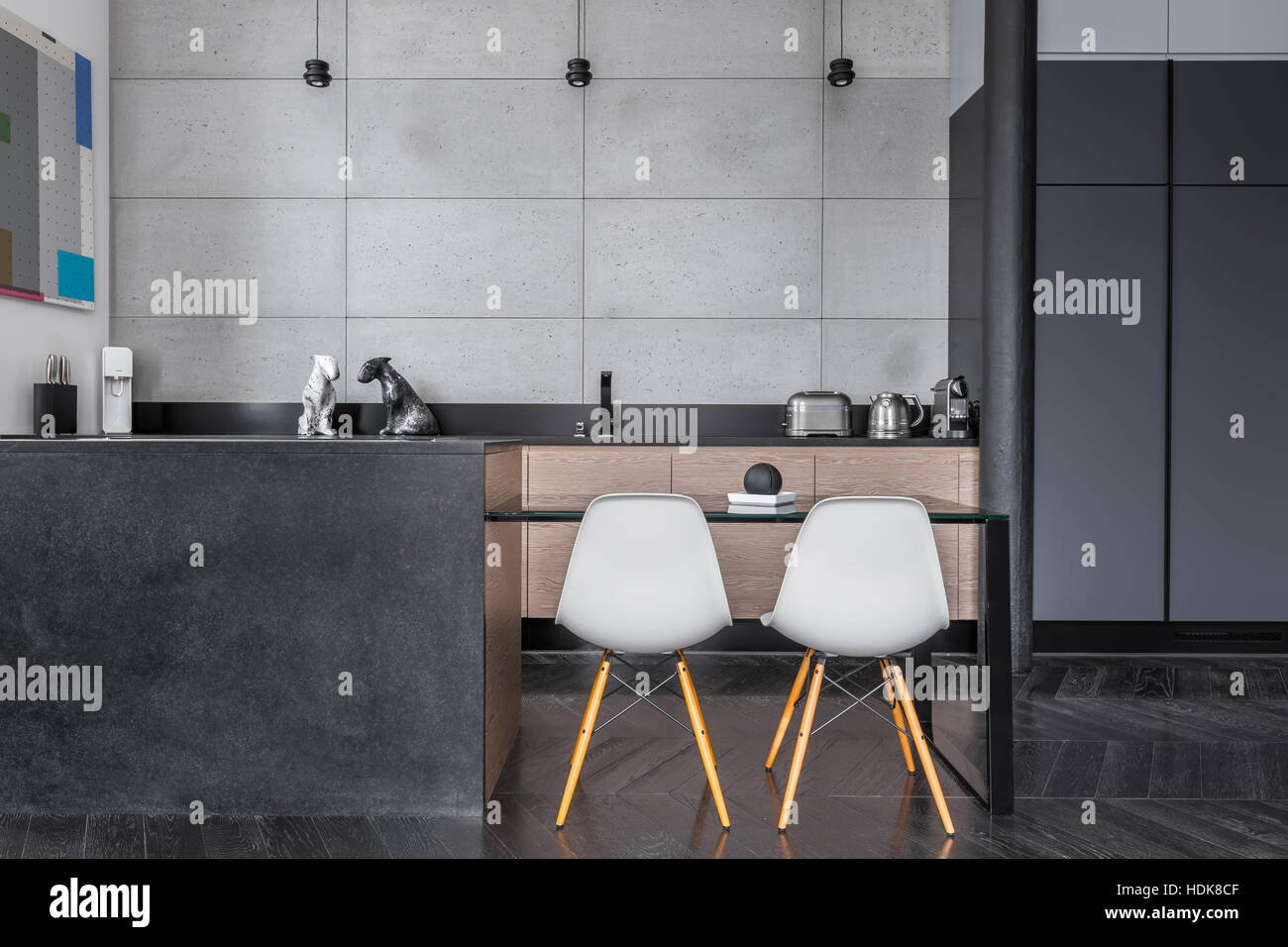 Contemporary White Kitchen with Concrete Countertop, Pull-Out Cutting Board  Stock Photo - Alamy