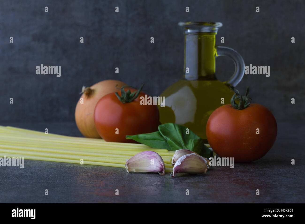 Spaghetti, tomato, onion, garlic, olive oil and basil of the
