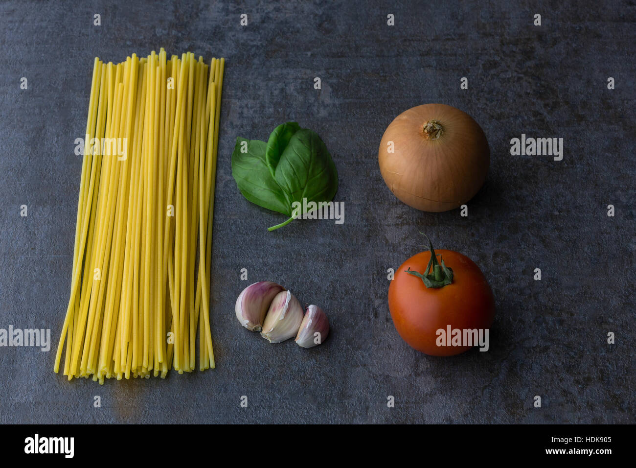 Spaghetti, tomato, onion, garlic, olive oil and basil of the