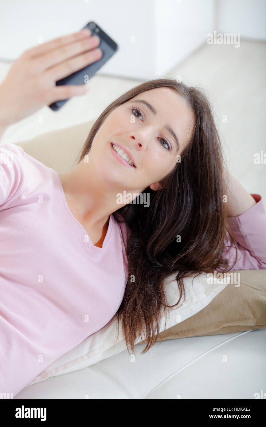 Woman layed on sofa hi-res stock photography and images - Alamy