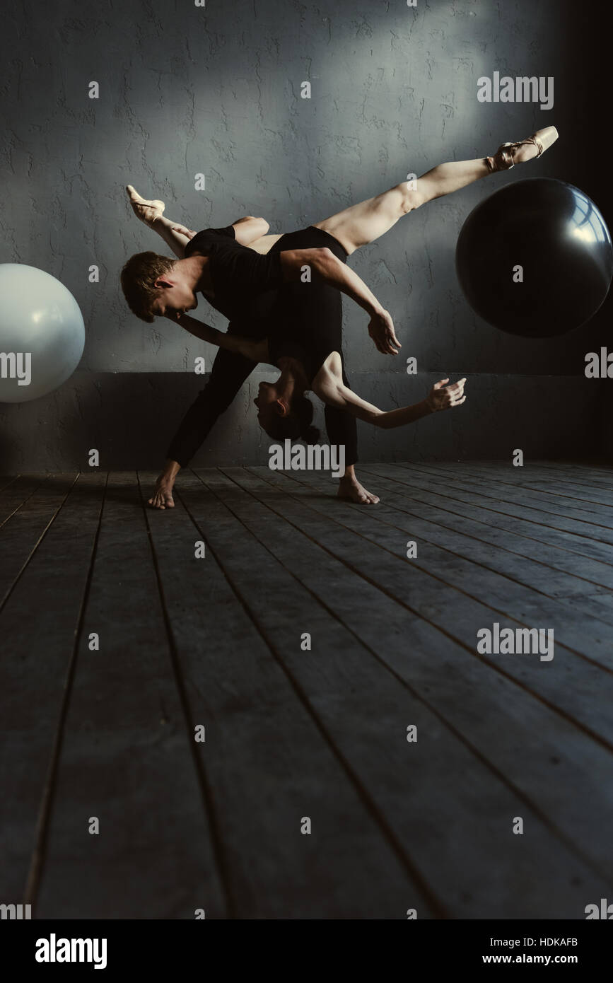 Flexible ballet dancers performing in the close interaction Stock Photo