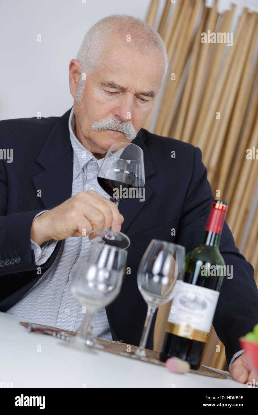 elderly man smelling red wine Stock Photo - Alamy