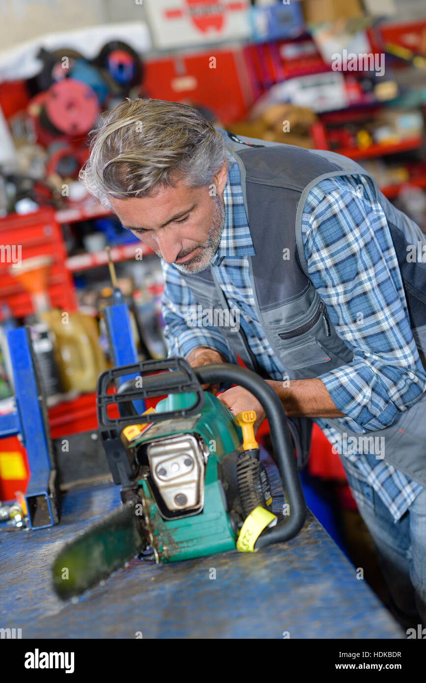 fixing the chainsaw blade Stock Photo Alamy