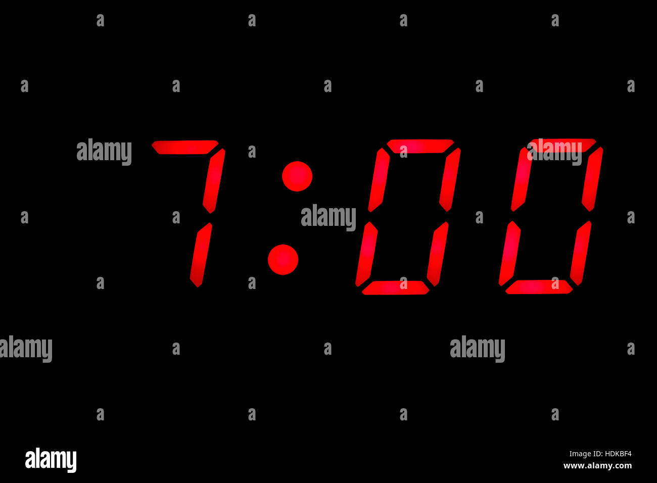 Digital clock closeup displaying 7:00 o'clock Stock Photo