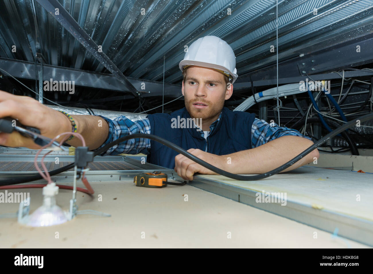 electrician working with electric wires in a factory Stock Photo Alamy