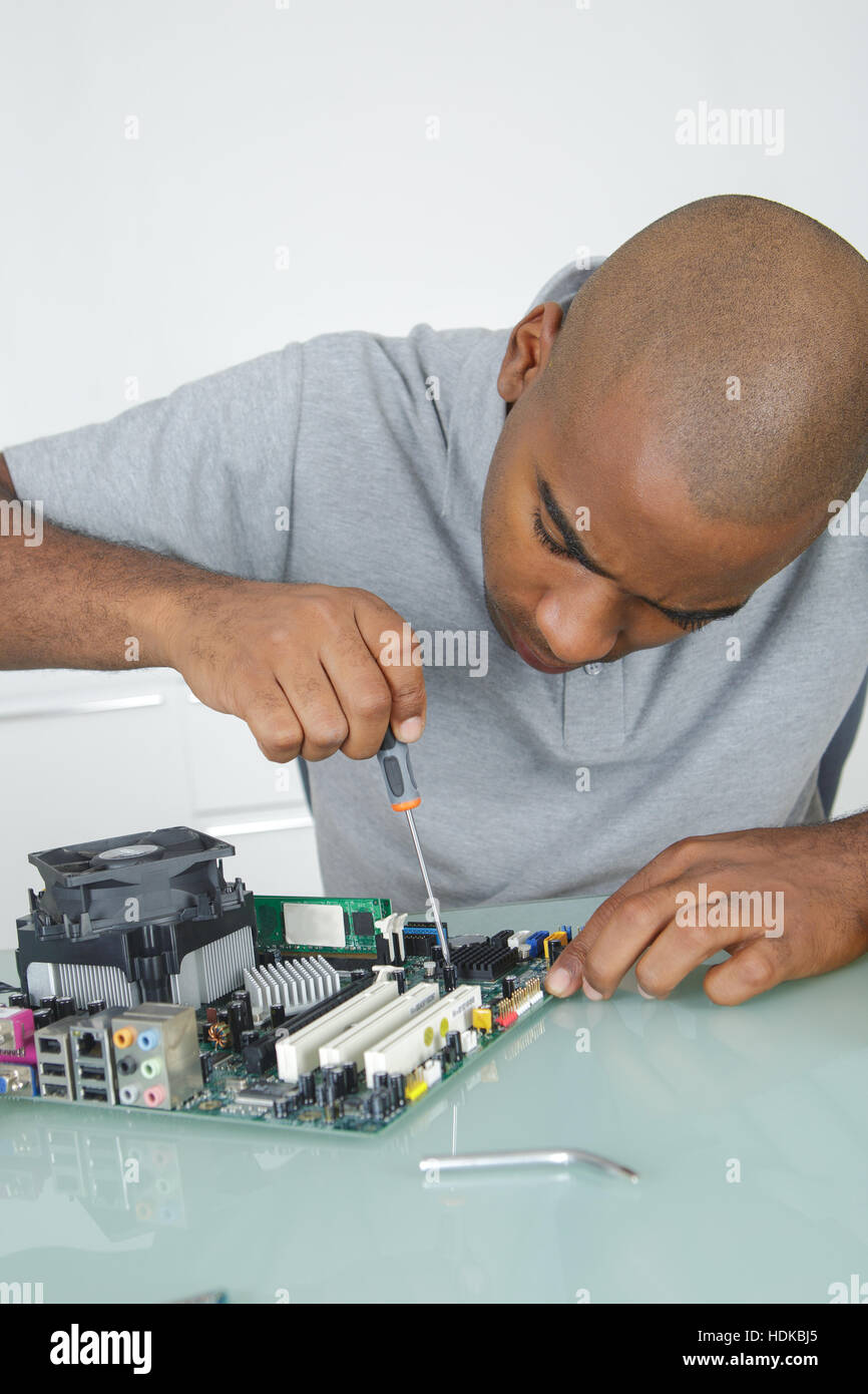 Fix Unit fixing a circuit unit Stock Photo - Alamy