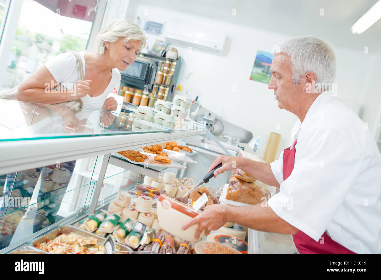 Buying meat from the butcher Stock Photo Alamy