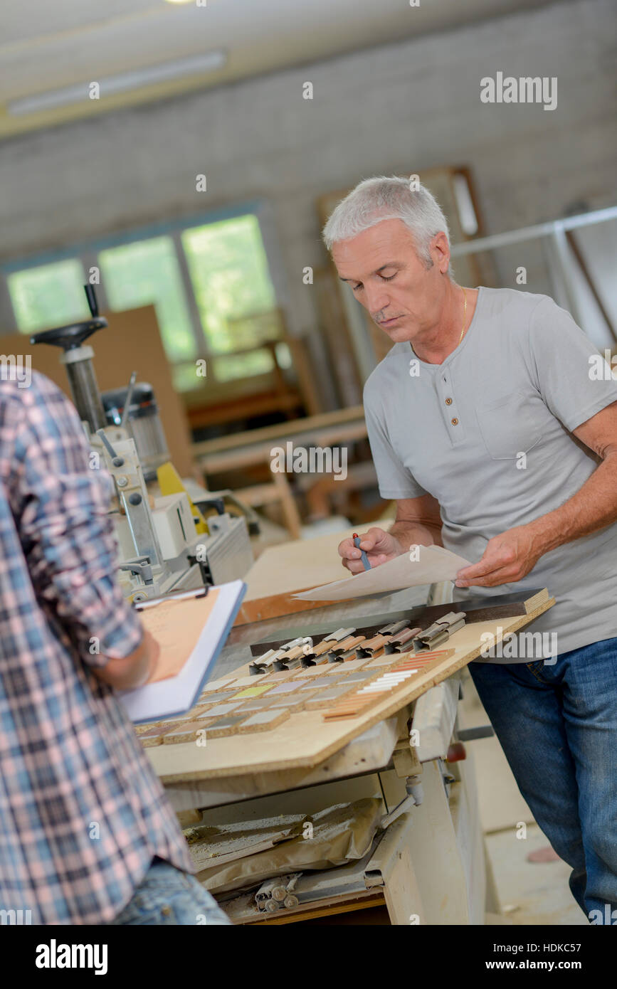Carpenter and his assistant Stock Photo Alamy