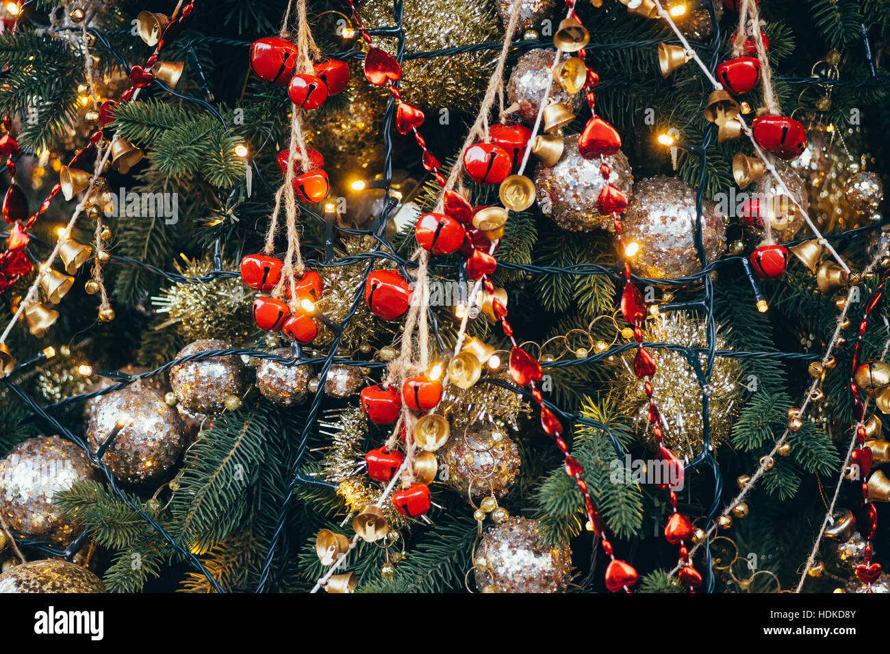 Fir decorated with Christmas ornaments and lights, winter holiday background Stock Photo