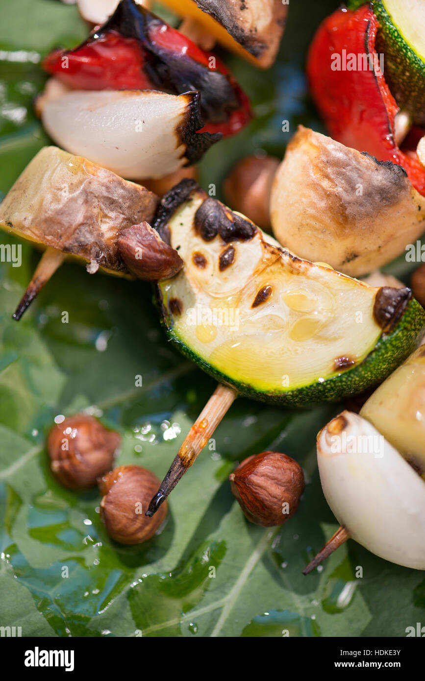 Vegetarian barbecue. Grilled vegetables on a stick. Healthy bbq food with zucchini, onion, potato and red pepper on skewer. Stock Photo