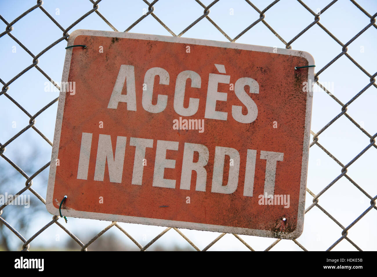 Warning sign in french on a fance Stock Photo Alamy